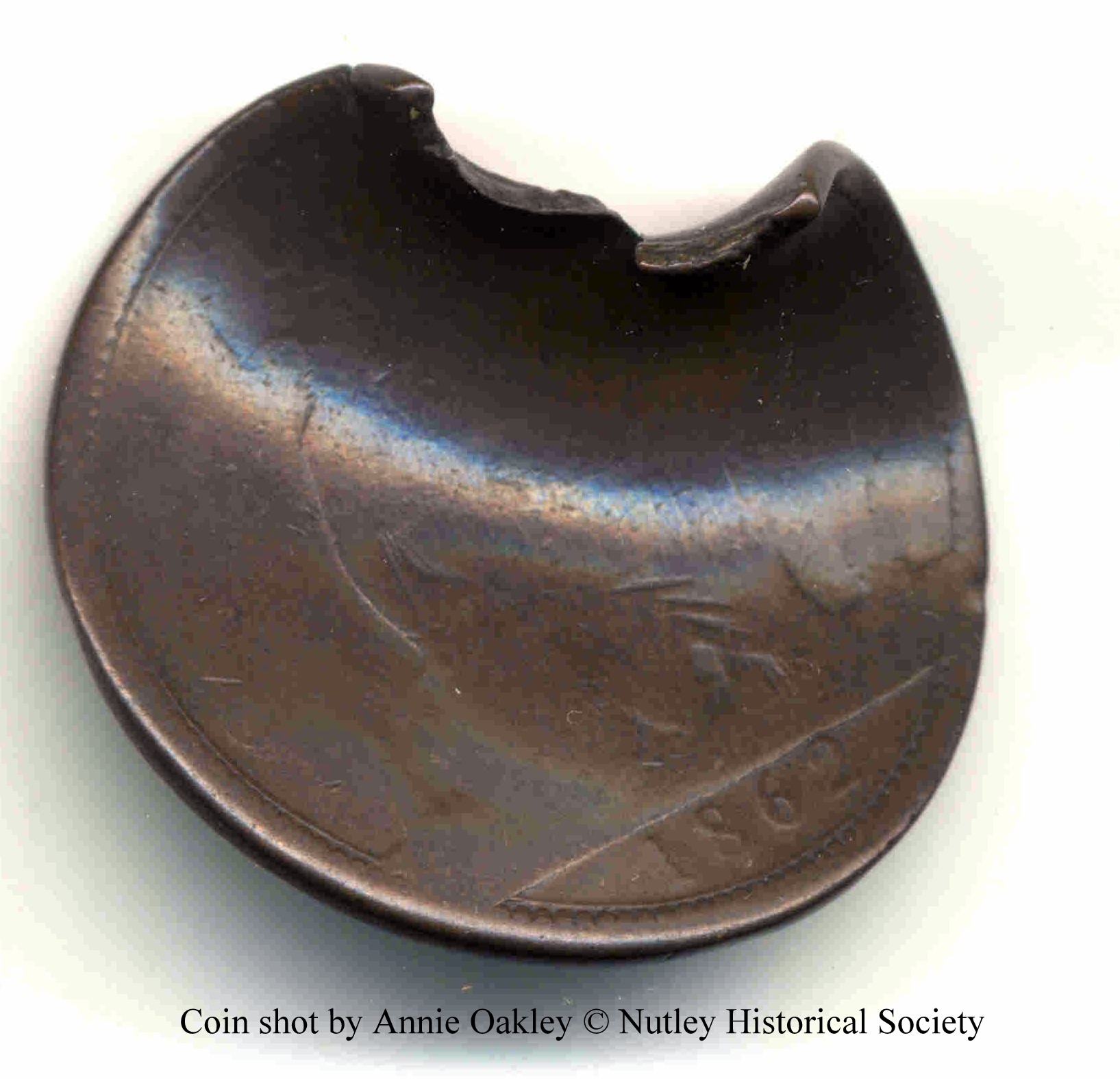 Coin shot by sharpshooter Annie Oakley - Nutley Museum, Nutley, NJ