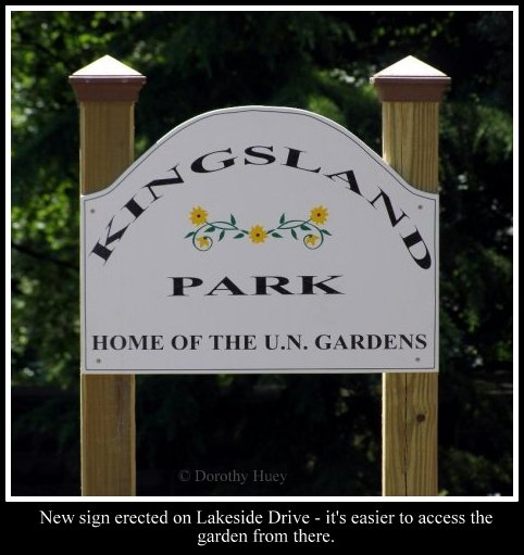 Kingsland Park Home of the UN Gardens sign post